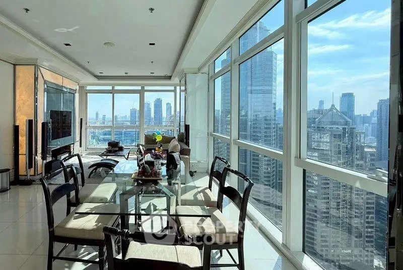 Luxurious high-rise apartment with stunning city skyline views and spacious dining area.