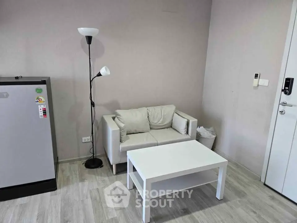 Cozy living room with modern decor and compact furniture setup