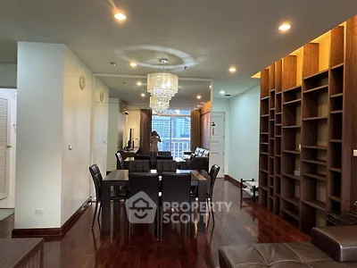 Spacious living room with elegant dining area and modern lighting