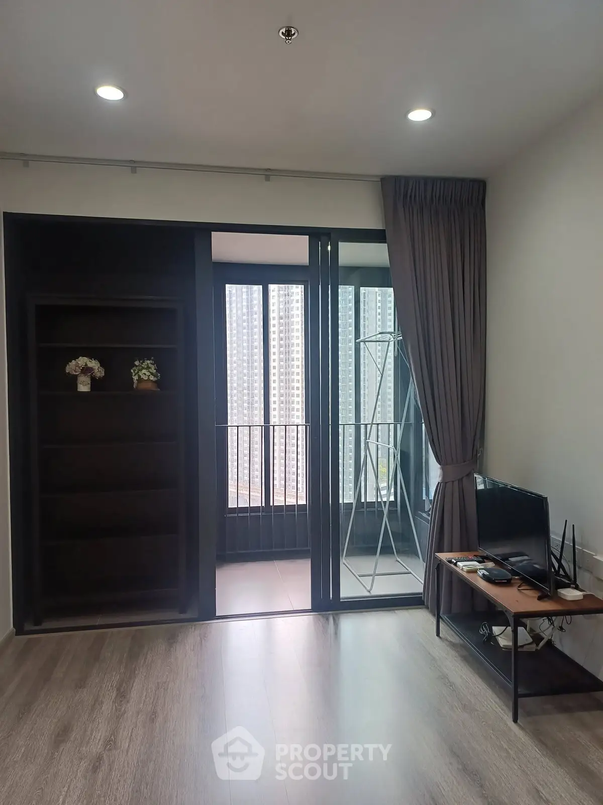 Modern living room with balcony view in high-rise apartment