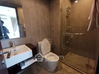 Modern bathroom with glass shower and sleek fixtures