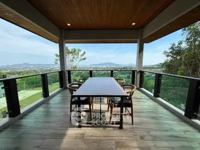 Stunning balcony with panoramic views and modern outdoor dining area.