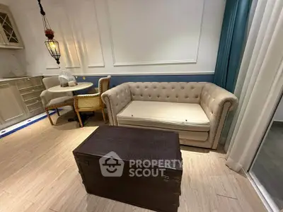 Charming living room with elegant sofa and cozy dining area in stylish apartment.