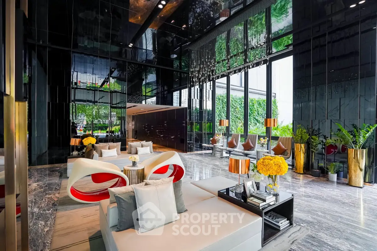 Luxurious modern lobby with sleek design and vibrant decor in upscale building.