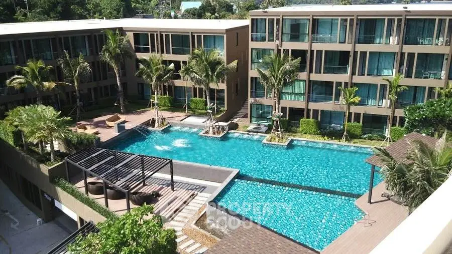 Luxurious apartment complex with stunning pool and lush landscaping
