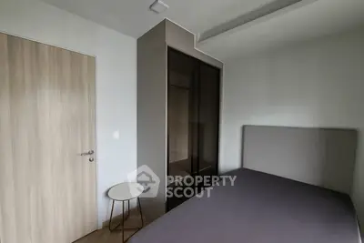 Modern minimalist bedroom with sleek wardrobe and cozy bed