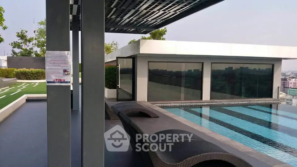 Luxurious rooftop pool with modern design and city views, perfect for relaxation and leisure.