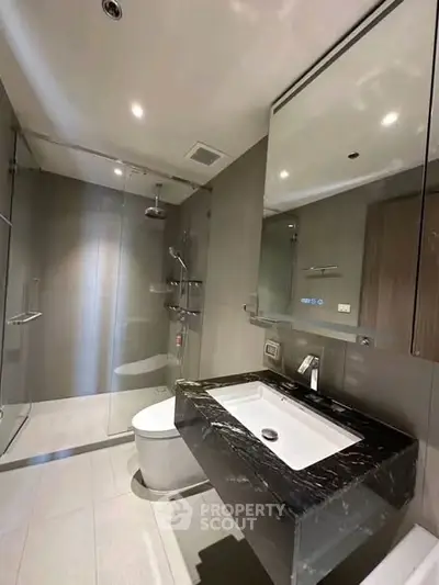 Modern bathroom with sleek design and glass shower enclosure