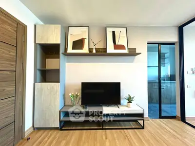 Modern living room with stylish TV unit and wooden flooring