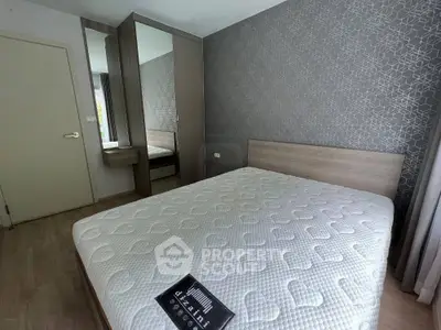 Modern bedroom with stylish decor and comfortable mattress in a cozy apartment.