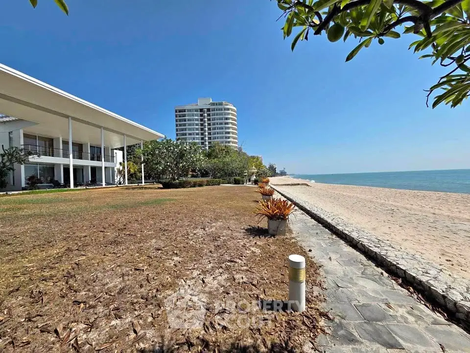 Stunning beachfront property with modern architecture and ocean views, perfect for luxury living.