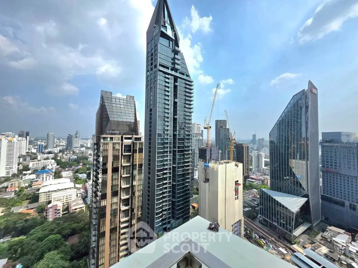 Stunning cityscape view with modern skyscrapers and clear blue sky, showcasing urban architectural marvels.