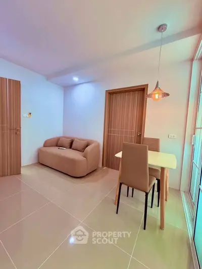 Modern living room with cozy sofa and dining area in stylish apartment