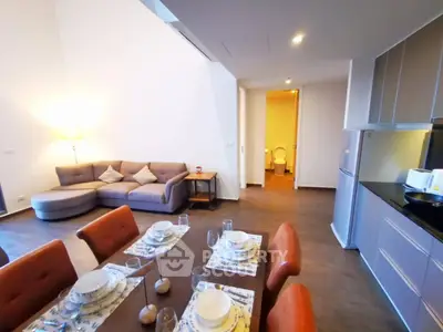 Spacious modern living room with dining area and sleek kitchen in open layout