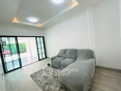 Modern living room with sleek design and cozy seating area