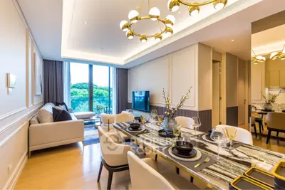 Luxurious open-plan living and dining area with elegant decor and stunning natural light.