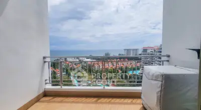 Stunning balcony view overlooking ocean and resort, perfect for relaxation and enjoying scenic vistas.