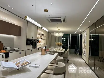 Luxurious modern kitchen with sleek design and elegant dining area