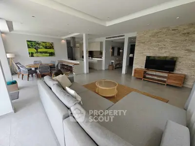 Spacious modern living room with open kitchen and stylish decor
