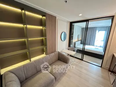 Modern living room with stylish shelving and cozy sofa in a contemporary apartment