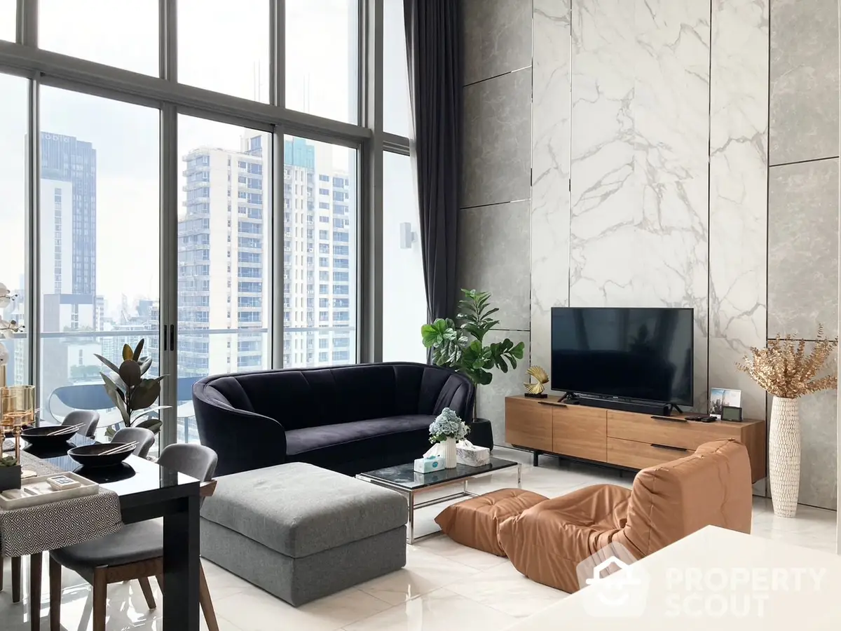 Luxurious living room with marble flooring, floor-to-ceiling windows offering a cityscape view, and elegant modern furnishings.