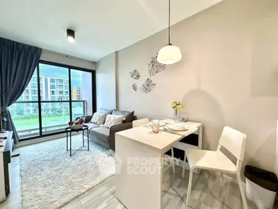 Modern living room with dining area and large window view in stylish apartment