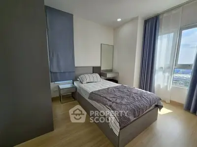 Modern bedroom with natural light and stylish decor