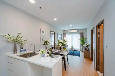 Modern open-plan living room with elegant decor and natural light