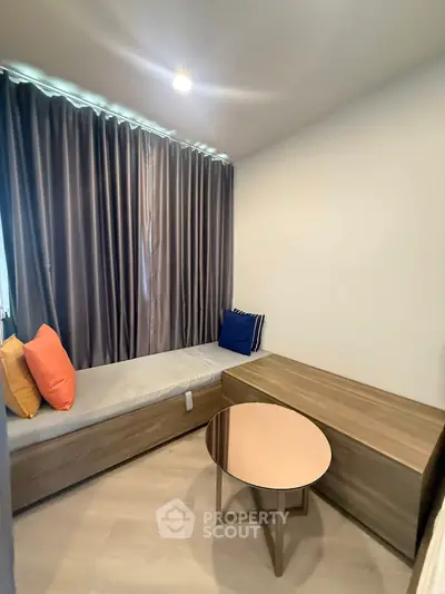 Cozy small living room with modern furniture and colorful cushions