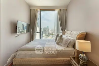 Luxurious bedroom with city view, elegant decor, and modern amenities.