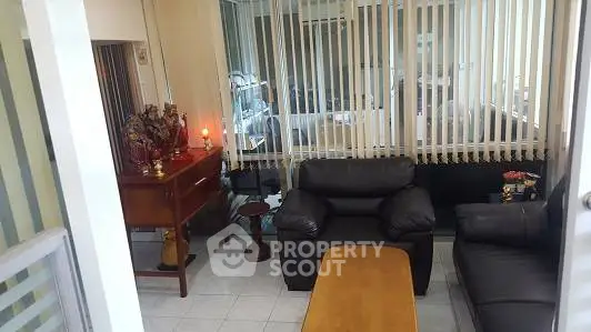 Cozy living room with leather sofas and natural light