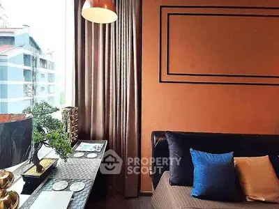 Stylish living room with modern decor and large window view