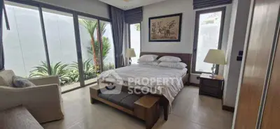 Luxurious bedroom with garden view and modern decor