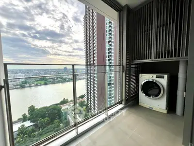 Stunning high-rise balcony with river view and washing machine
