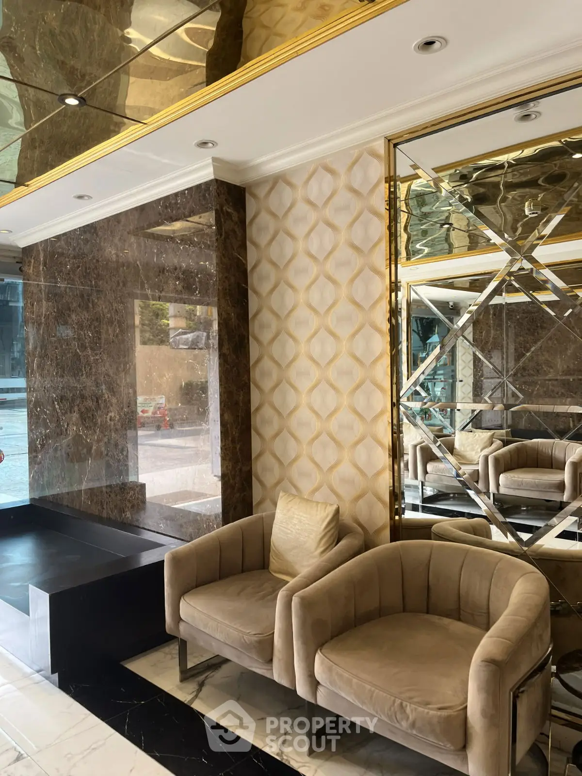 Luxurious lobby with elegant seating and mirrored accents