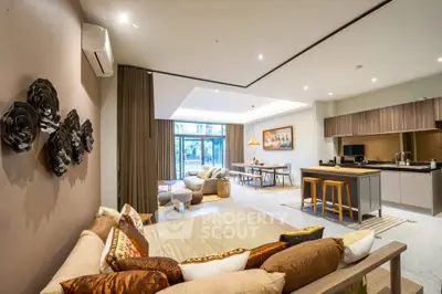 Spacious modern living room with open kitchen and stylish decor
