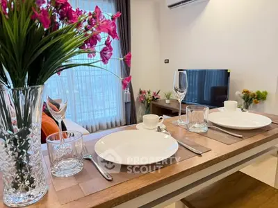 Elegant dining setup in modern living room with TV and vibrant decor