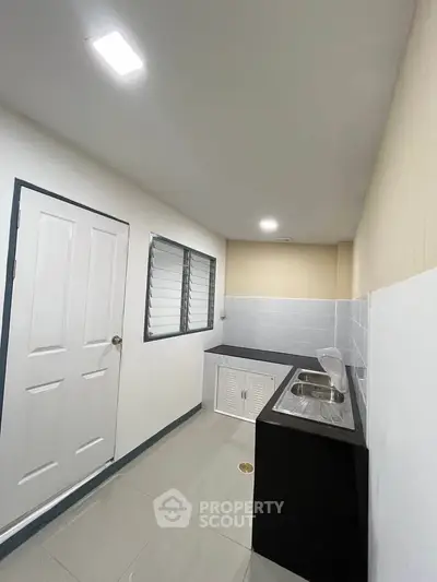 Modern kitchen with sleek countertops and ample storage space