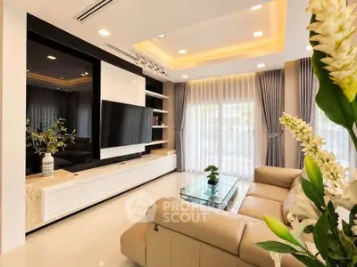Luxurious modern living room with elegant decor and large windows