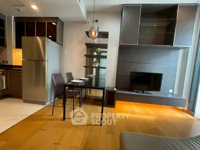 Modern living room with sleek furniture and open kitchen layout