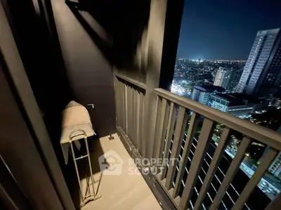Stunning city view from a high-rise balcony at night, perfect for urban living enthusiasts.
