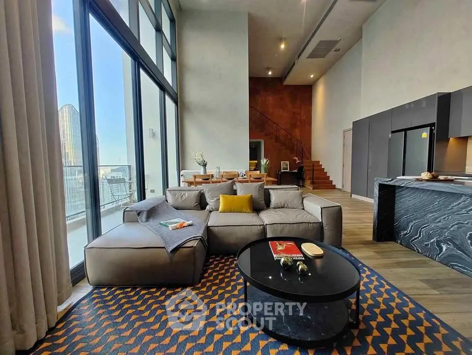 Luxurious modern living room with floor-to-ceiling windows and stylish decor