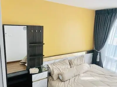 Cozy bedroom with modern decor and large window for natural light