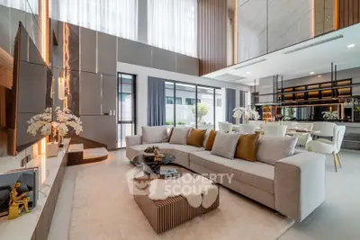 Luxurious modern living room with high ceilings and elegant decor