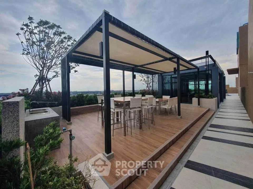 Luxurious rooftop terrace with modern pergola and stunning views, perfect for entertaining and relaxation.