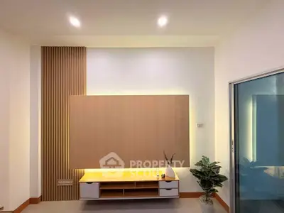 Modern minimalist living room with stylish wooden paneling and sleek furniture.