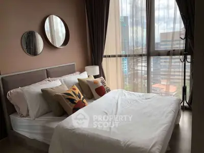 Modern bedroom with large windows and stylish decor in urban apartment