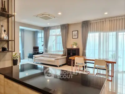 Spacious modern living room with elegant decor and ample natural light