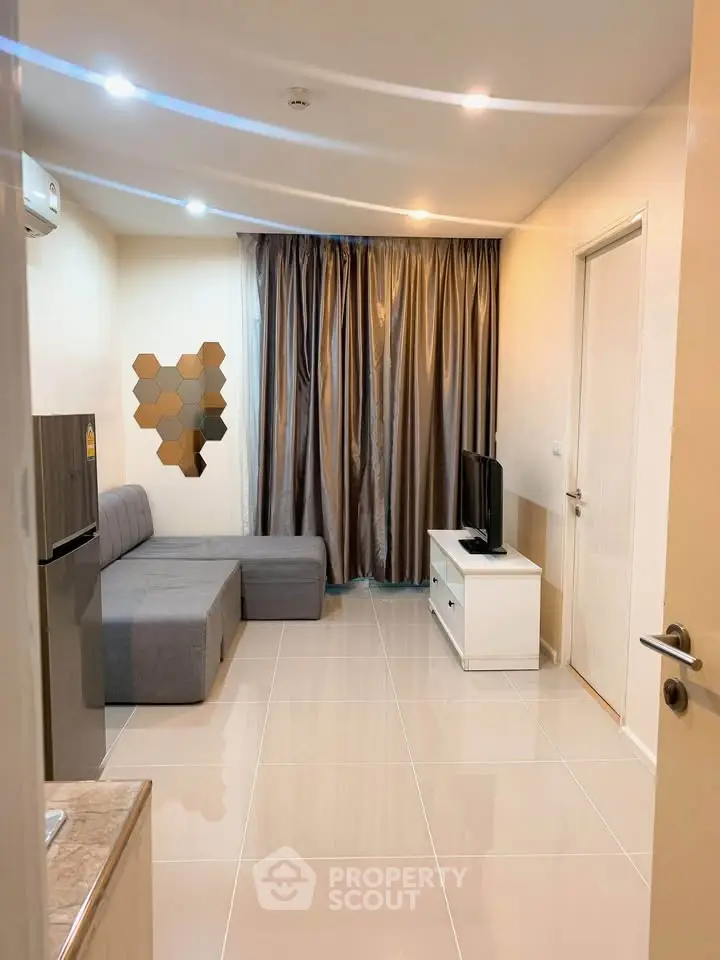 Modern living room with sleek furniture and stylish decor in a contemporary apartment.