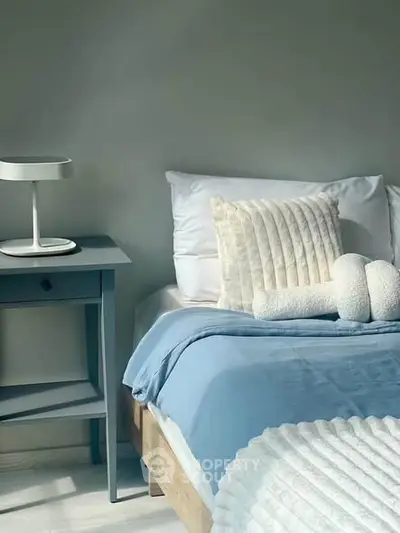 Cozy bedroom with stylish decor and soft lighting